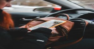 woman on her phone while driving